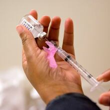 A nurse prepares a flu shot at the Salvation Army in Atlanta. Georgia, like much of the country, is facing a particularly challenging flu season driven by one of this year’s dominant strains. (David Goldman/AP 2018)