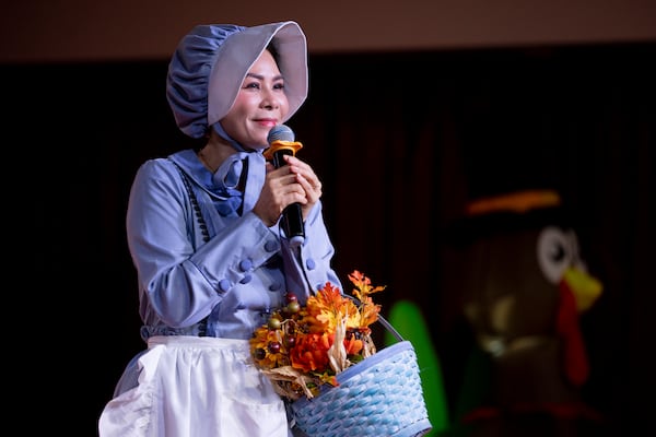 Von Tran, CEO of the First Senior Center, speaks during the center's Thanksgiving celebration. (Jason Getz/AJC)
