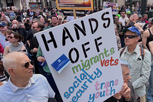 People gather to protest President Donald Trump's policies on Saturday, April 19, 2025 in New York. (AP Photo/Joseph Frederick)