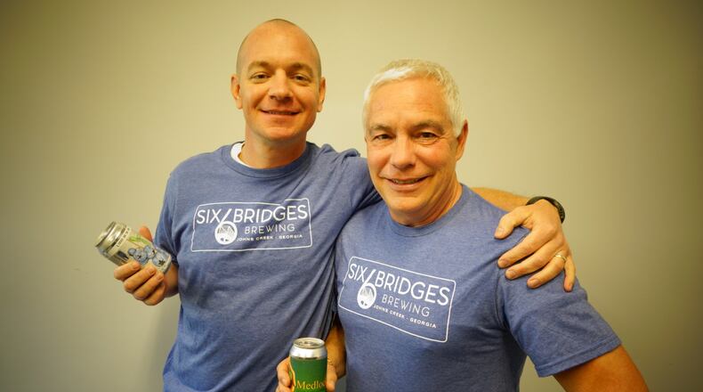 Clay and Charles Gridley opened Six Bridges Brewing in Johns Creek a little more than a year ago. CONTRIBUTED BY SIX BRIDGES BREWING