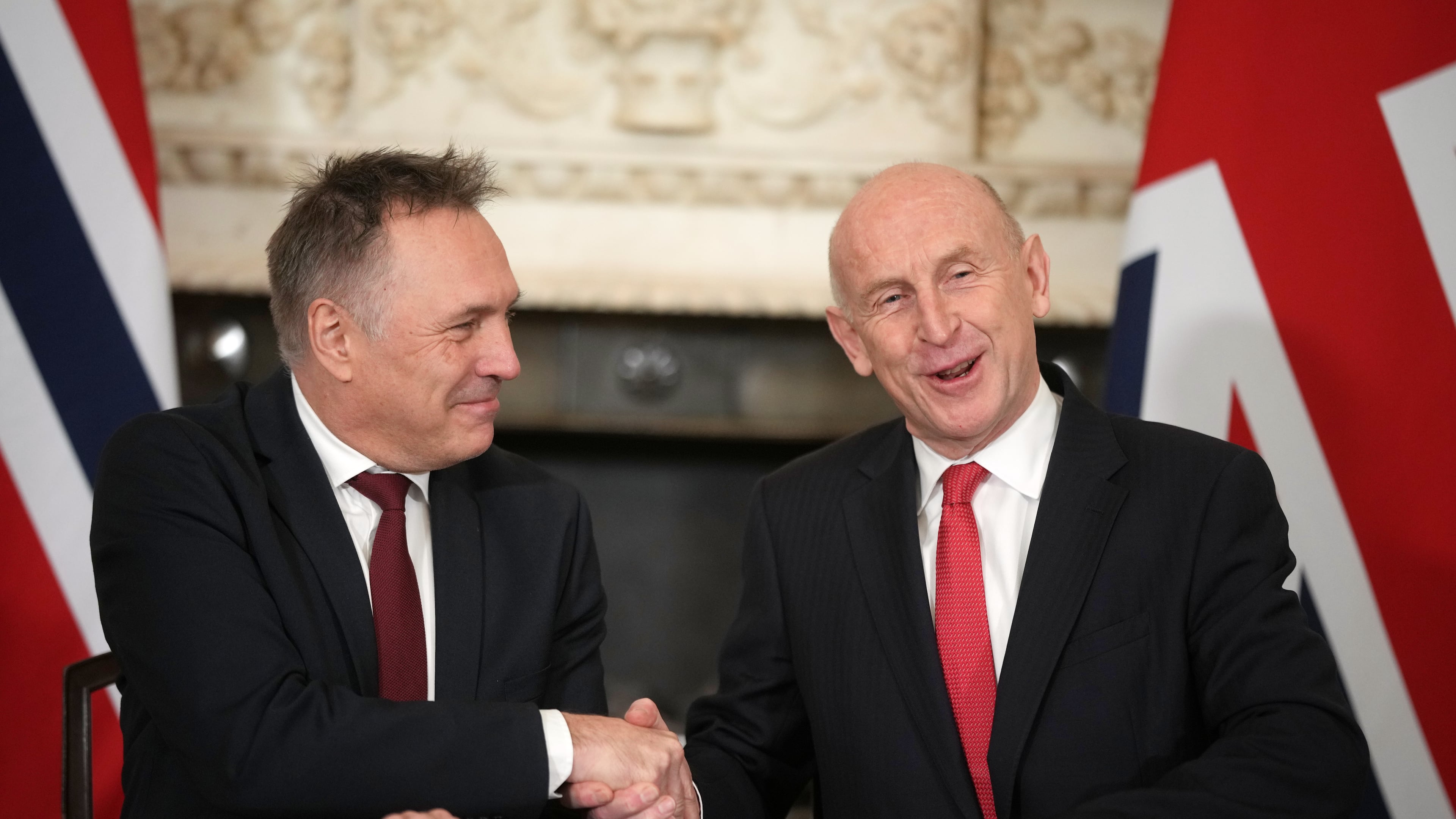 Norway's Minister of Defence Tore O. Sandvik, left, and Britain's Secretary of State for Defence John Healey shake hands during the signing of a Strategic Defence Agreement in Downing Street in London, Thursday, Dec. 4, 2025. (AP Photo/Alastair Grant, pool)