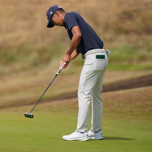 Michael Kim of the United States putts on the 3rd green during the second day of the British Open Golf championships at Royal Birkdale golf club, in Southport, England, Friday, July 17, 2026. (AP Photo/David Goldman)