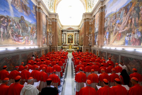 Cardinals gather in the Pauline Chapel before they form a procession to enter the Sistine Chapel at the Vatican to start the conclave to elect the successor of late Pope Francis, Wednesday, May 7, 2025. (Vatican Media via AP)