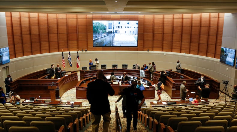People explore the new assembly hall at a ribbon cutting celebrating the new assembly hall and renovations at the Fulton County government building in Atlanta, Georgia, on Wednesday, May 5, 2021. (Rebecca Wright for the Atlanta Journal-Constitution)
