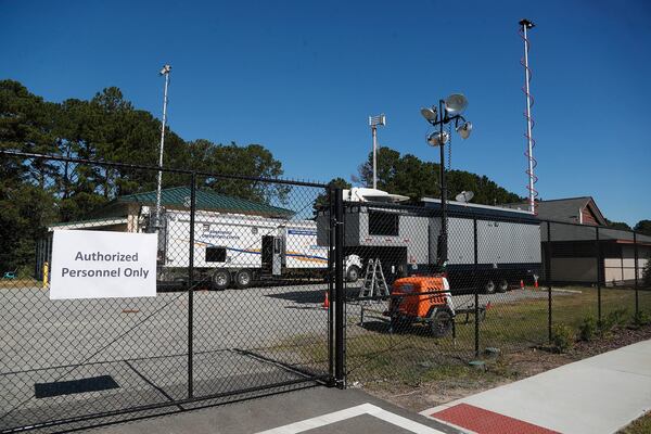 Mobile Command units sit outside the L. Scott Stell Park Community Center on Tuesday October 18, 2022 as investigators search for the remains of Quinton Simon at a Waste Management landfill near the park.