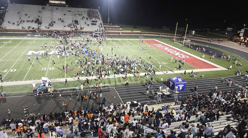 Students empty the stands after Northside of Warner Robins defeats Warner Robins on Sept. 4 to end a nine-game losing streak in the rivalry. (Cody Chaffins/AJC)