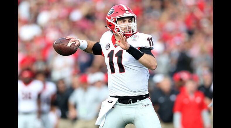 <p>Jake Fromm #11 of the Georgia Bulldogs throws a pass in the 2018 College Football Playoff Semifinal at the Rose Bowl Game presented by Northwestern Mutual at the Rose Bowl on January 1, 2018 in Pasadena, California.</p> <p>Nick Chubb #27 of the Georgia Bulldogs runs the ball during the second quarter against the Alabama Crimson Tide in the CFP National Championship presented by AT&T at Mercedes-Benz Stadium on January 8, 2018 in Atlanta, Georgia.</p> <p>DeVonta Smith #6 of the Alabama Crimson Tide celebrates catching a 41 yard touchdown pass to beat the Georgia Bulldogs in the CFP National Championship in overtime at Mercedes-Benz Stadium. (Photo by Kevin C. Cox/Getty Images)</p> <p>Jake Fromm is sacked by Raekwon Davis during the second half in the CFP National Championship presented by AT&T at Mercedes-Benz Stadium on January 8, 2018 in Atlanta, Georgia. (Photo by Kevin C. Cox/Getty Images)</p> <p>Head coach Kirby Smart of the Georgia Bulldogs reacts to a play during the second quarter against the Alabama Crimson Tide in the CFP National Championship game. </p>