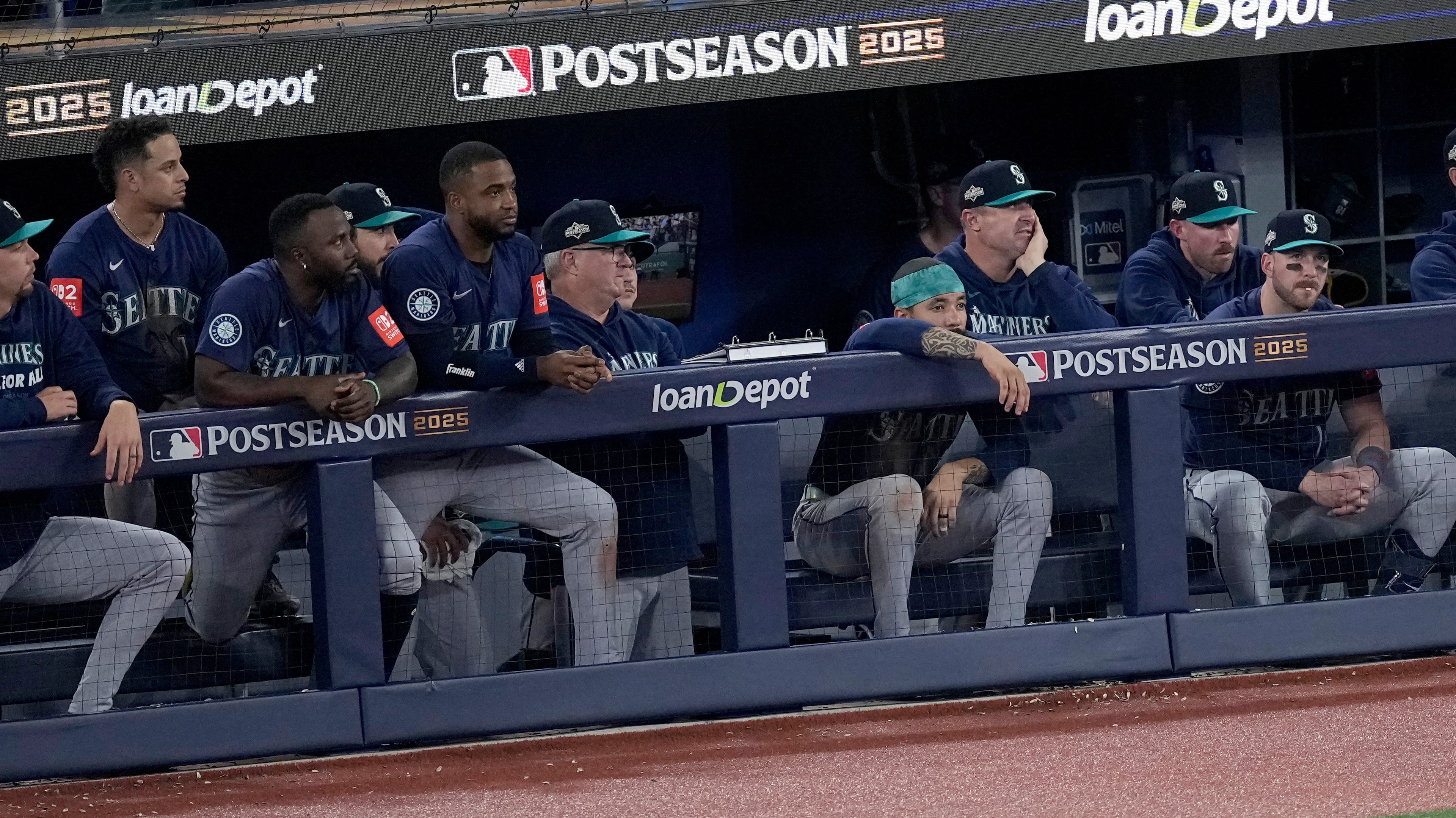 The Seattle Mariners watch from their dugout during the ninth inning in Game 7 of baseball's American League Championship Series against the Toronto Blue Jays, Monday, Oct. 20, 2025, in Toronto. (AP Photo/David J. Phillip)