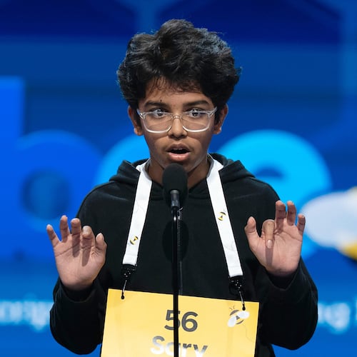 Sarv Dharavane, 12, Dunwoody, Ga., spells his word during the quarterfinals of the Scripps National Spelling Bee at DAR Constitution Hall, Wednesday, May 27, 2026, in Washington. (AP Photo/Jose Luis Magana)