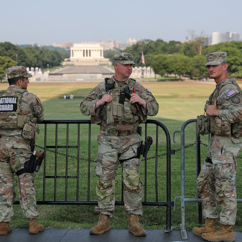 Member of the National Guard patrol at the base of the Washington Monument, Wednesday, July 15, 2026, in Washington. The Lincoln Memorial is in the background, (AP Photo/Rahmat Gul)