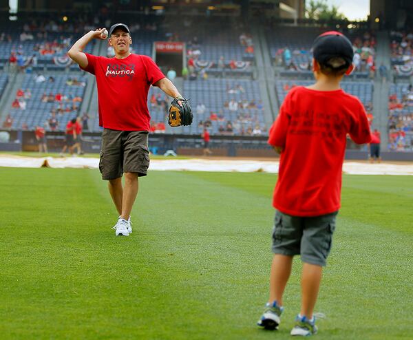 Before the game, fans had a chance to play catch on the field - in celebration of Fathers Day - at Turner Field Sunday.