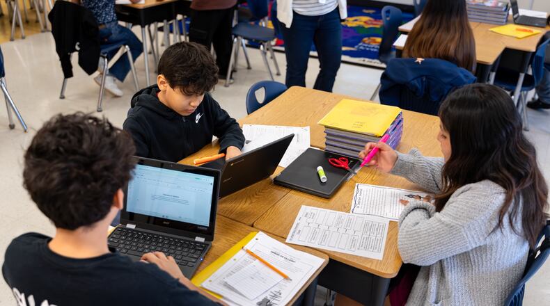 Vickery Mill Elementary School fifth grade students work together during a reading and writing class Thursday, March 5, 2026. (Ben Hendren for the AJC)