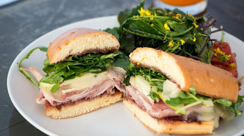 The Sarah-Witch with brie, Beech Creek pink lady apples, shaved ham, arugula and house preserves is served on a southern baguette. Contributed by Mia Yakel