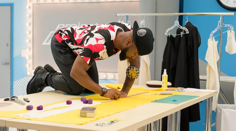 Ken Laurence working on his bold yellow dress for his final collection. CREDIT: Lifetime