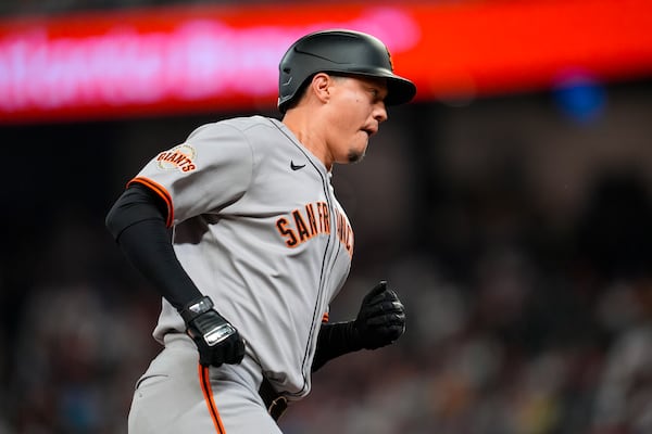 San Francisco Giants' Wilmer Flores (41) rounds the bases after hitting a three-run home run against the Atlanta Braves inning of a baseball game, Tuesday, July 22, 2025, in Atlanta. (AP Photo/Mike Stewart)