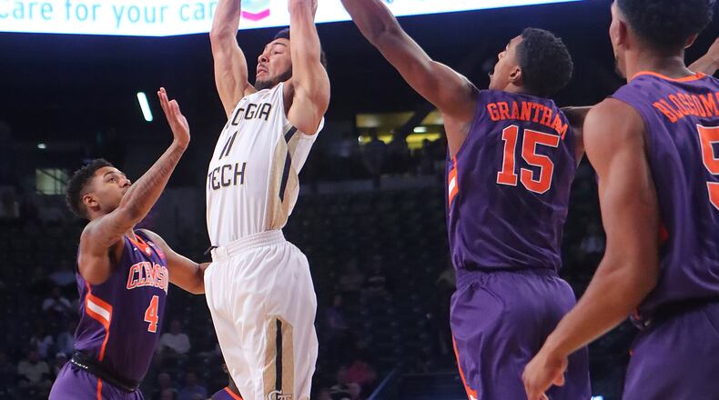 January 12, 2017, Atlanta: Georgia Tech guard Josh Heath goes up for a pass over Clemson defenders Shelton Mitchell (left) and Donte Grantham during an NCAA basketball game on Thursday, Jan. 12, 2017, in Atlanta. Curtis Compton/ccompton@ajc.com