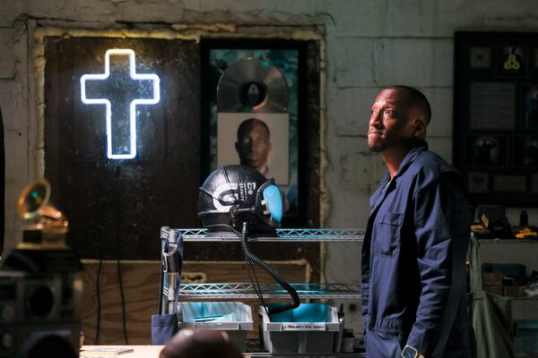 Lecrae interacts with items from his past as he films content for an upcoming album release announcement, Monday, June 9, 2025, in Atlanta. Lecrae’s Reach Records has recently celebrated 20 years. (Jason Getz/AJC)