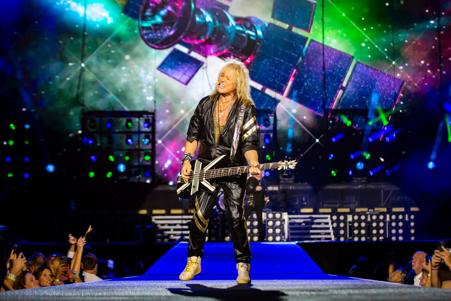 Def Leppard rocks the crowd with all the hits spanning their 48 year career at Truist Park in Atlanta on Saturday, July 13, 2024. (RYAN FLEISHER FOR THE ATLANTA JOURNAL-CONSTITUTION)