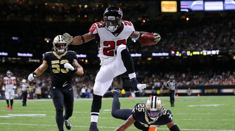 The Falcons Brian Hill scores in style last week against New Orleans. (Jonathan Bachman/Getty Images/TNS)