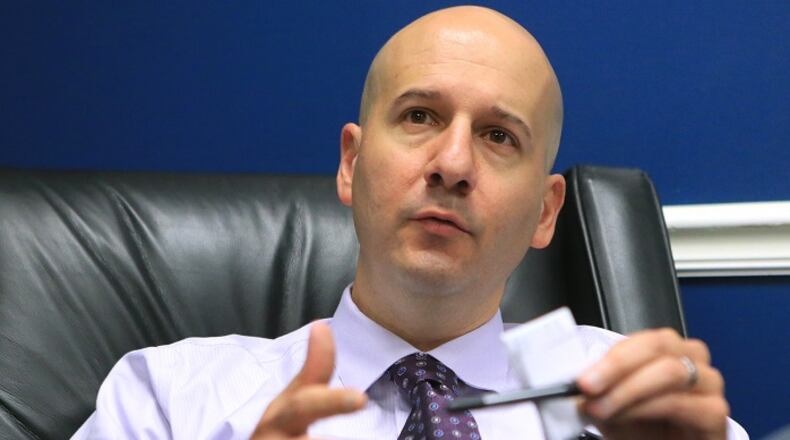100515 ATLANTA: Braves general manager John Coppolella answers questions during an end of season interview with the media in the team clubhouse on Monday in Atlanta.  Curtis Compton / ccompton@ajc.com