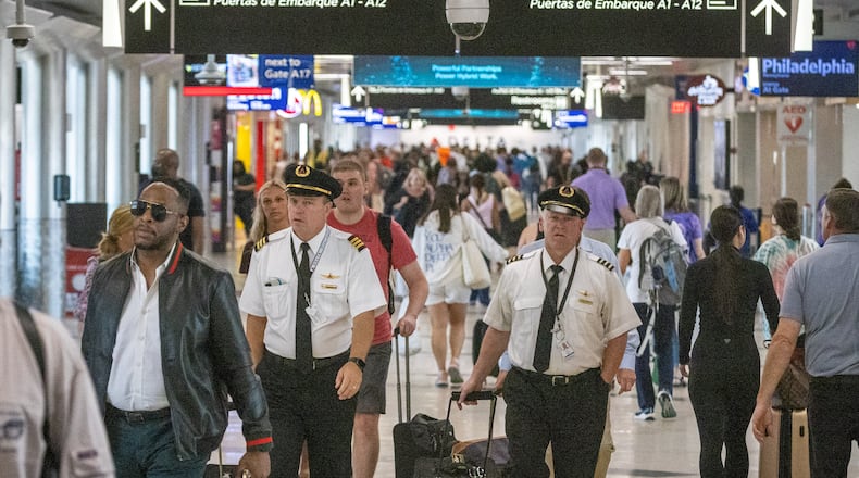 People make their way through Concourse A at Hartsfield-Jackson Atlanta International Airport Wednesday, June 22, 2022. Steve Schaefer / steve.schaefer@ajc.com)
