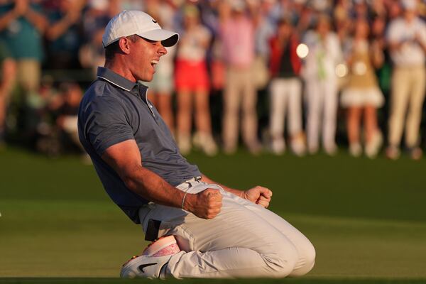 Rory McIlroy, of Northern Ireland, celebrates winning in a playoff against Justin Rose, of England, after the final round the Masters golf tournament, Sunday, April 13, 2025, in Augusta, Ga. (AP Photo/Matt Slocum)