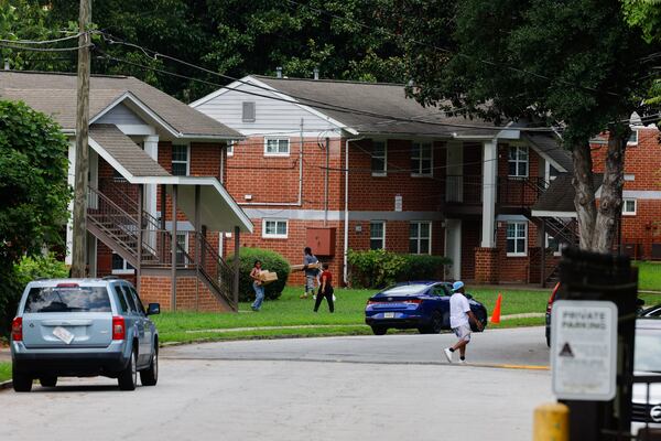 People walk through the Trestletree Village Apartments on Tuesday, Aug. 11, 2026, in Atlanta. In subsidized housing, there is little incentive to accommodate resident demands. (Arvin Temkar/AJC)
