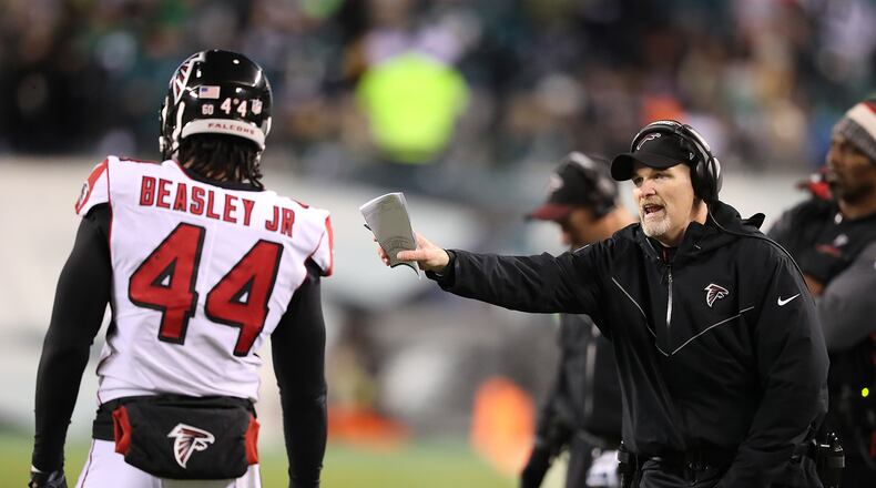 Vic Beasley Jr. and Dan Quinn on that Saturday in Philadelphia.