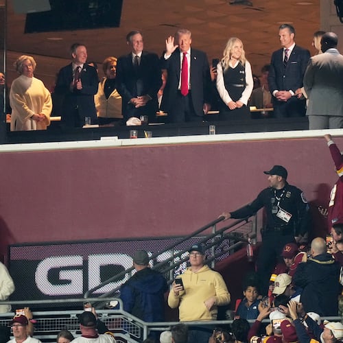 President Donald Trump is seen in a suite during the first half of an NFL football game between the Washington Commanders and the Detroit Lions Sunday, Nov. 9, 2025, in Landover, Md. (AP Photo/Stephanie Scarbrough)
