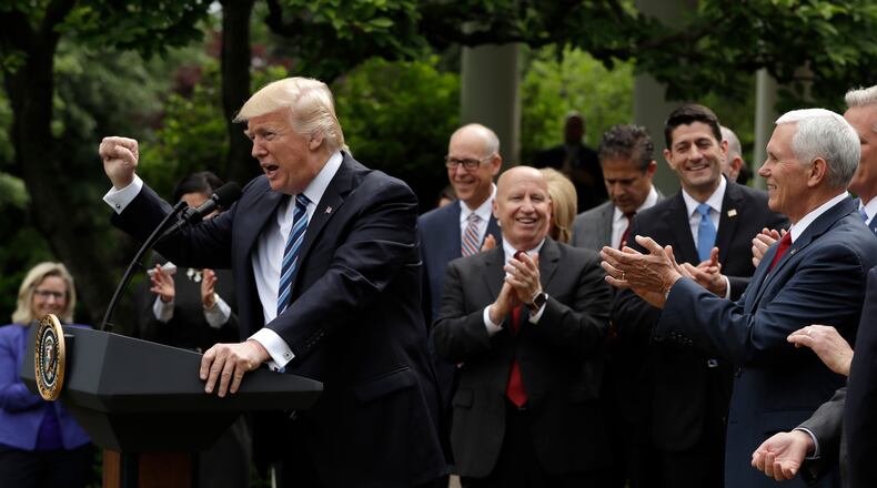 President Donald Trump gestures as he speaks in the Rose Garden of the White House in Washington, Thursday, May 4, 2017, after the House pushed through a health care bill. (AP Photo/Evan Vucci)