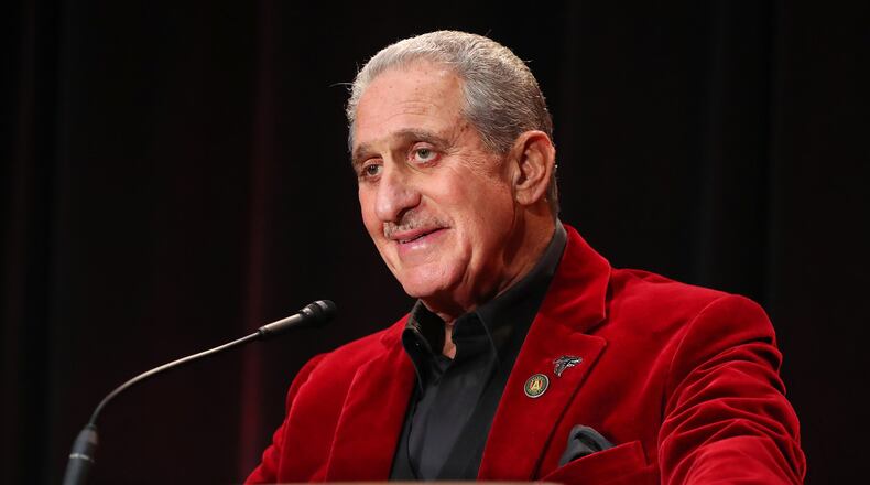 Falcons owner Arthur Blank, wearing a team color bright red jacket, chuckles while asked a question about his dancing while holding his only media availability in Houston for the Super Bowl during a news conference at the George R. Brown Convention Center on Friday Feb. 3, 2017, in Houston. Blank has danced in the locker room and on stage with his players on their march to the Super Bowl. Curtis Compton/ccompton@ajc.com