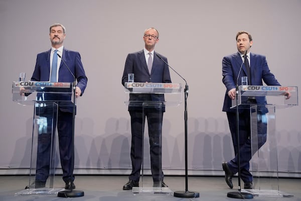 Markus Soeder, chairman of Bavarian's Christian Social Union party, Friedrich Merz, Christian Democratic Union party chairman and the Social Democratic Party co-leaders Lars Klingbeil, address the media after reaching an agreement between their parties on a coalition for a new German government at a news conference in Berlin, Germany, Wednesday, April 9, 2025. (AP Photo/Ebrahim Noroozi)
