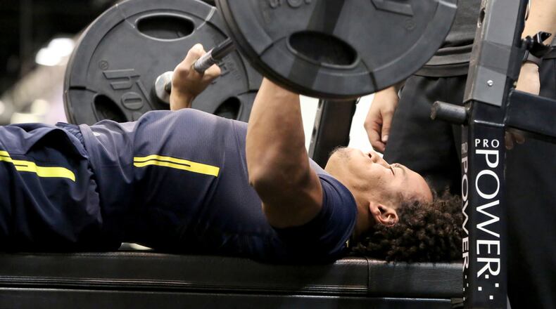 Mississippi tight end Evan Engram performs the bench press at the 2017 NFL football scouting combine Friday, March 3, 2017, in Indianapolis. (AP Photo/Gregory Payan)