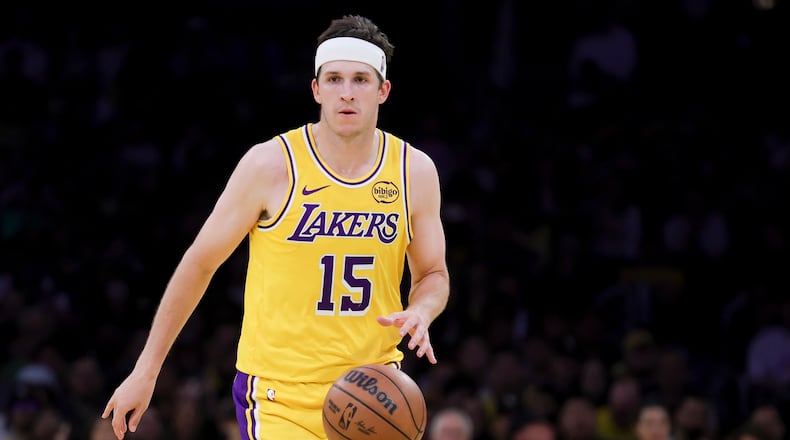 Los Angeles Lakers guard Austin Reaves brings the ball up court during the second half of an NBA basketball game against the Washington Wizards Monday, March 30, 2026, in Los Angeles. (AP Photo/Ryan Sun)
