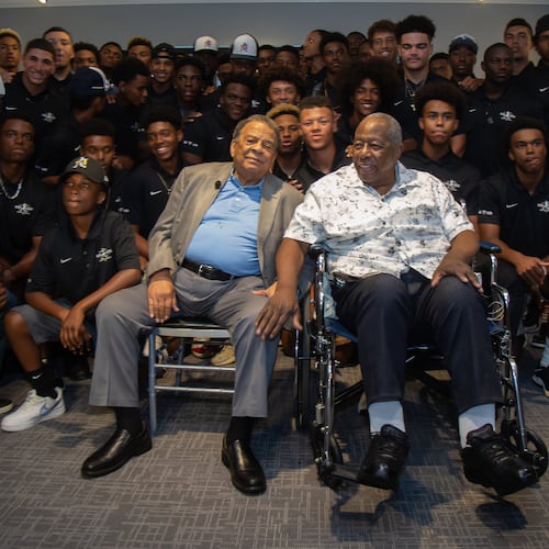 Andrew Young (left) and Hank Aaron pose for photos with the participants at the end of the Hank Aaron Invitational at SunTrust Park in Atlanta Aug. 2, 2019.  STEVE SCHAEFER / SPECIAL TO THE AJC