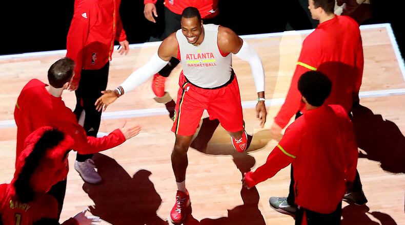 January 15, 2017, Atlanta: Dwight Howard gets fives from teammates taking the floor to play the Bucks in a NBA basketball game on Sunday, Jan. 15, 2017, in Atlanta. Curtis Compton/ccompton@ajc.com