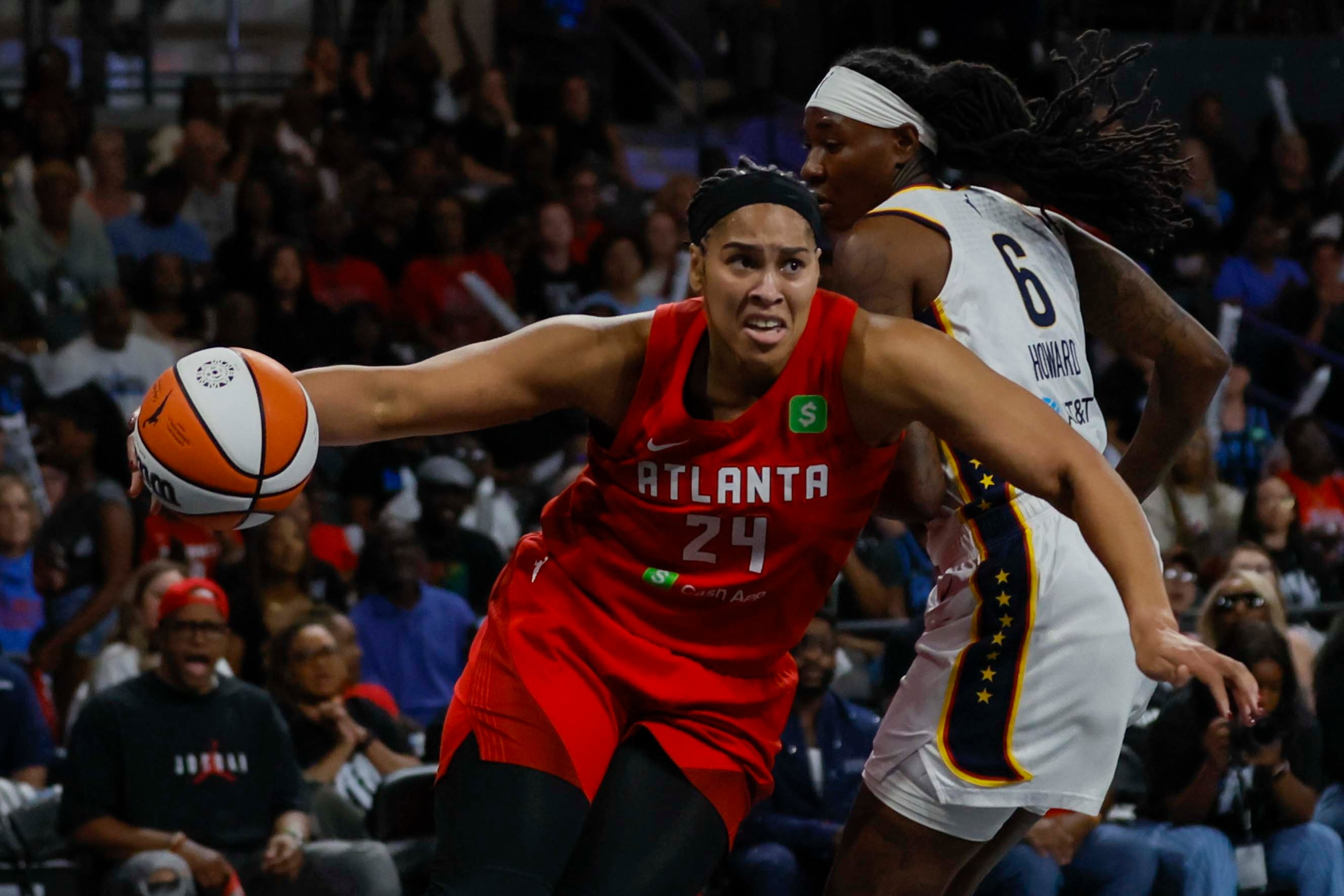 Atlanta Dream forward Brionna Jones (24) drbbles against Indiana Fever forward Natasha Howard (6) during the first half of a WNBA first-round playoff game at Gateway Center Arena on Thursday, Sept. 18, 2024, in Atlanta. (Miguel Martinez/ AJC)