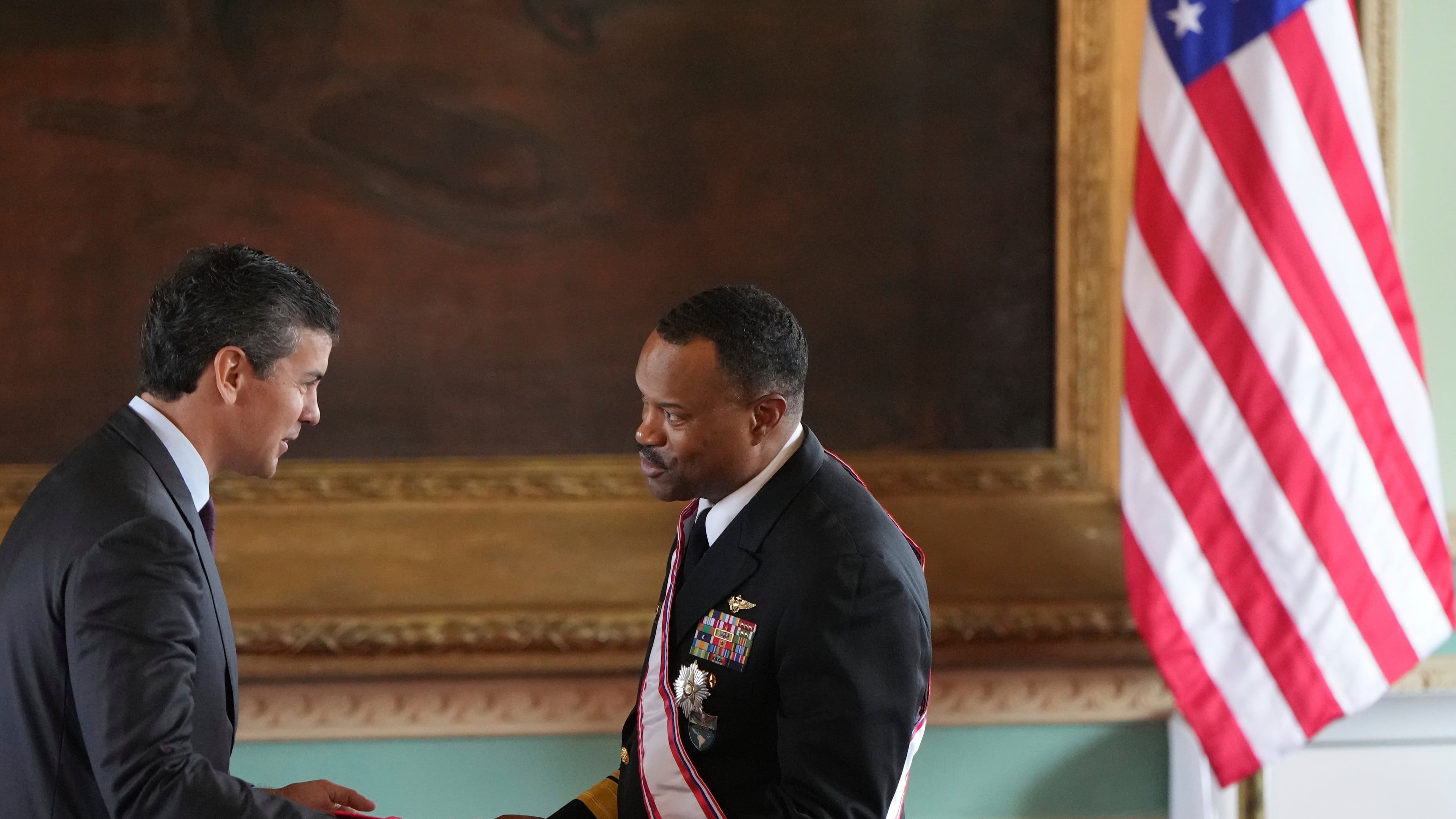 FILE - Paraguay's President Santiago Peña awards the Order of Merit "Gral Div Bernardino Caballero" in the grade of "Gran Cross", to Navy Adm. Alvin Holsey, commander of US Southern Command, at Government Palace in Asuncion, Paraguay, Aug. 23, 2025. (AP Photo/Jorge Saenz, File)