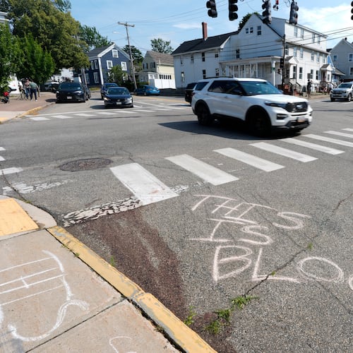 Blood is seen on the pavement near the scene of a shooting involving U.S. Immigration and Customs Enforcement, Monday, July 13, 2026 in Biddeford, Maine. (AP Photo/Robert F. Bukaty)
