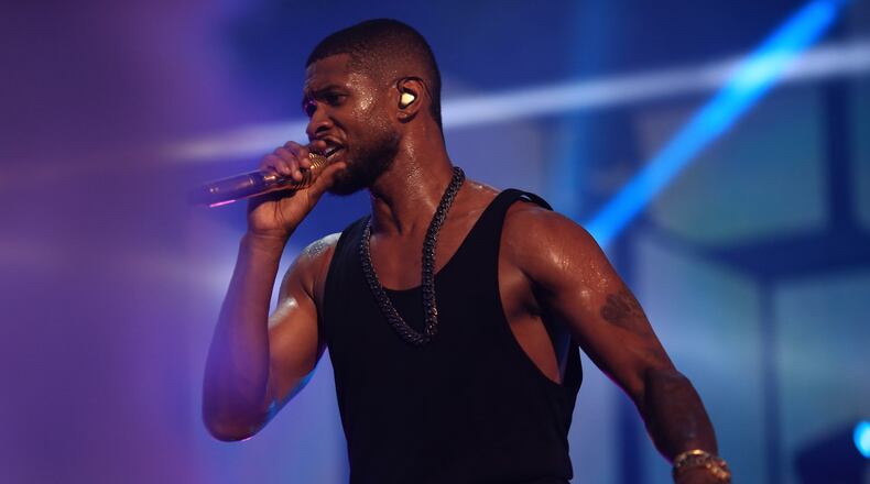 LAS VEGAS, NV - SEPTEMBER 19: Singer/songwriter Usher performs onstage during the 2014 iHeartRadio Music Festival at the MGM Grand Garden Arena on September 19, 2014 in Las Vegas, Nevada. (Photo by Christopher Polk/Getty Images for iHeartMedia) Usher brought his moves and his muscle to the IHeartRadio concert in Las Vegas in September. Photo: Getty Images.