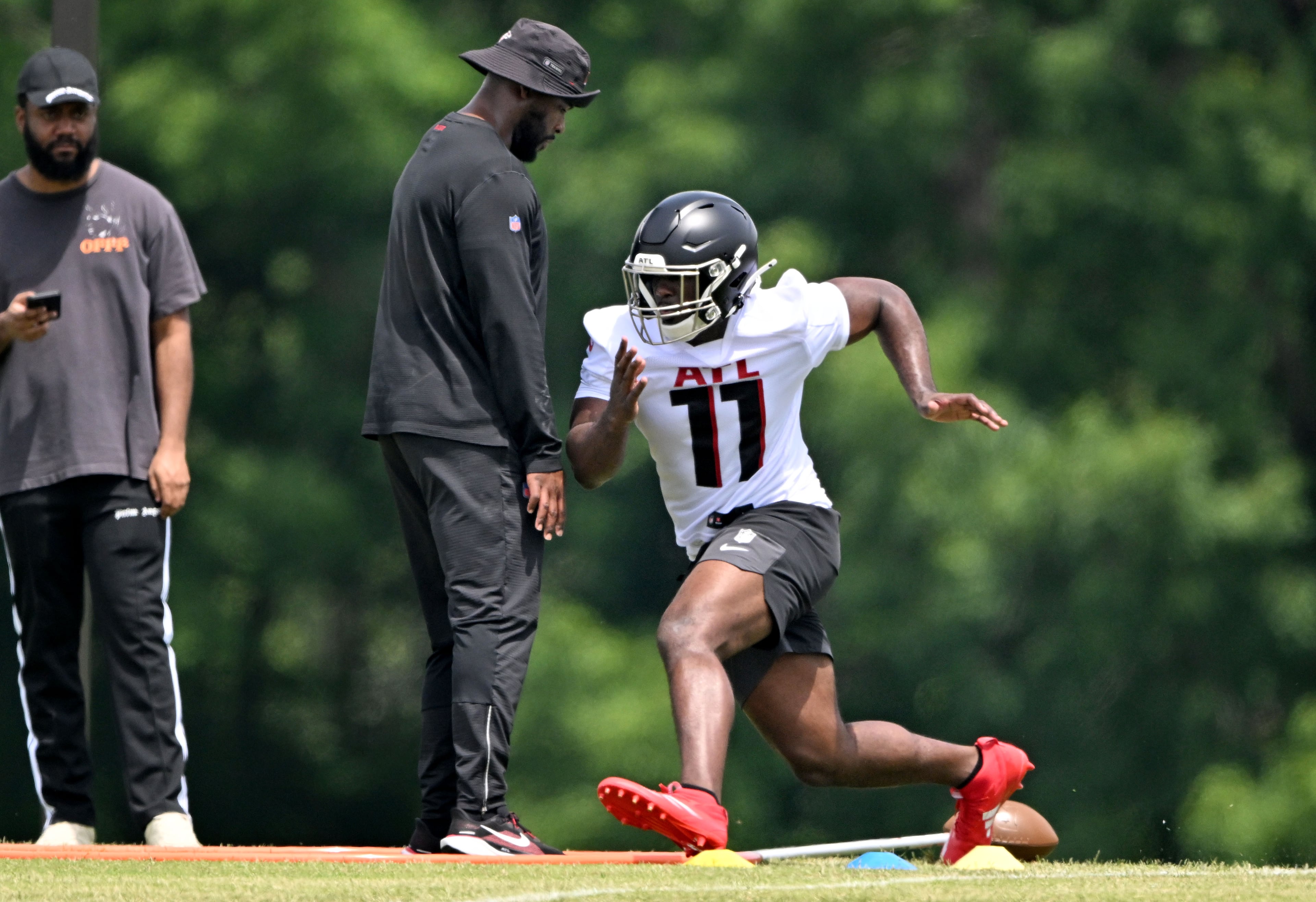 Atlanta Falcons edge rusher Jalon Walker runs a drill during the Atlanta Falcons Rookie Minicamp at the Atlanta Falcons Training Camp, Friday, May 9, 2025, in Flowery Branch. (Hyosub Shin/AJC)