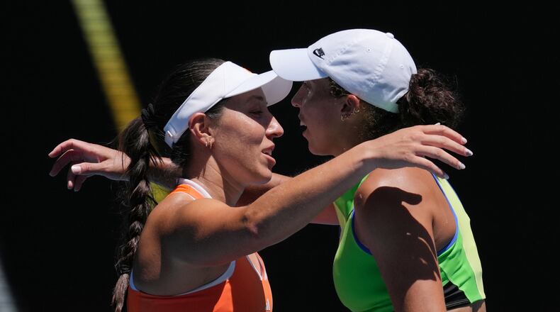 Jessica Pegula, left, of the U.S., is congratulated by her compatriot Madison Keys after winning their fourth round match at the Australian Open tennis championship in Melbourne, Australia, Monday, Jan. 26, 2026. (AP Photo/Mark Baker)