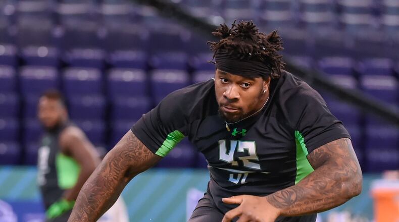 Mississippi defensive lineman Robert Nkemdiche runs a drill at the NFL football scouting combine, Sunday, Feb. 28, 2016, in Indianapolis. (AP Photo/L.G. Patterson)