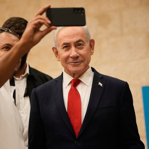 A man takes a selfie with Israeli Prime Minister Benjamin Netanyahu during the Likud party primary elections ahead of Israel's general election in October, in Jerusalem, Monday, Aug. 17, 2026. (AP Photo/Ohad Zwigenberg, Pool)