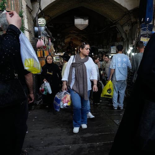 People walk at Tehran's traditional main bazaar, Iran, Saturday, Aug. 8, 2026. (AP Photo/Vahid Salemi)