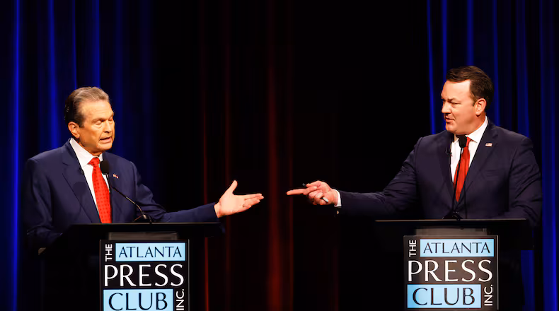Republican candidates for governor, Rick Jackson, left, and Lt. Gov. Burt Jones interact at the Atlanta Press Club Loudermilk-Young Republican governor primary election debate at Georgia Public Broadcasting, Monday, April 27, 2026, in Atlanta. (Arvin Temkar/Atlanta Journal-Constitution via AP)