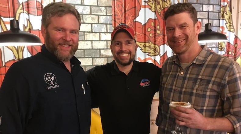 Jim Chasteen of ASW Distillery (from left), Kraig Torres of Hop City, and Nick Purdy of Wild Heaven at the opening of Boxcar in the Lee + White development in Atlanta’s West End. CONTRIBUTED BY BOB TOWNSEND