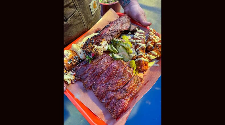 The menu at Gene's in Atlanta's East Lake neighborhood features a variety of smoked meats, appetizers and even vegetarian options. / Courtesy of Gene's