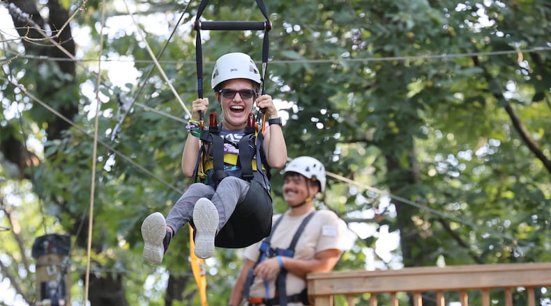 Kiley Griggs ziplines at Camp Twin Lakes in Rutledge during this summer’s Wheelchairs 4 Kids Camp. (Photo Courtesy of J DAVID)