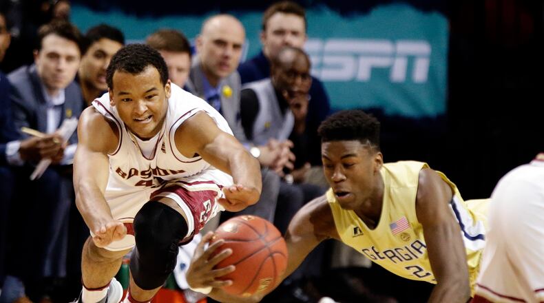 Georgia Tech's Moses Wright and Boston College's Steffon Mitchell battle for the basketball during ACC Tournament play Tuesday. Tech lost 87-77.